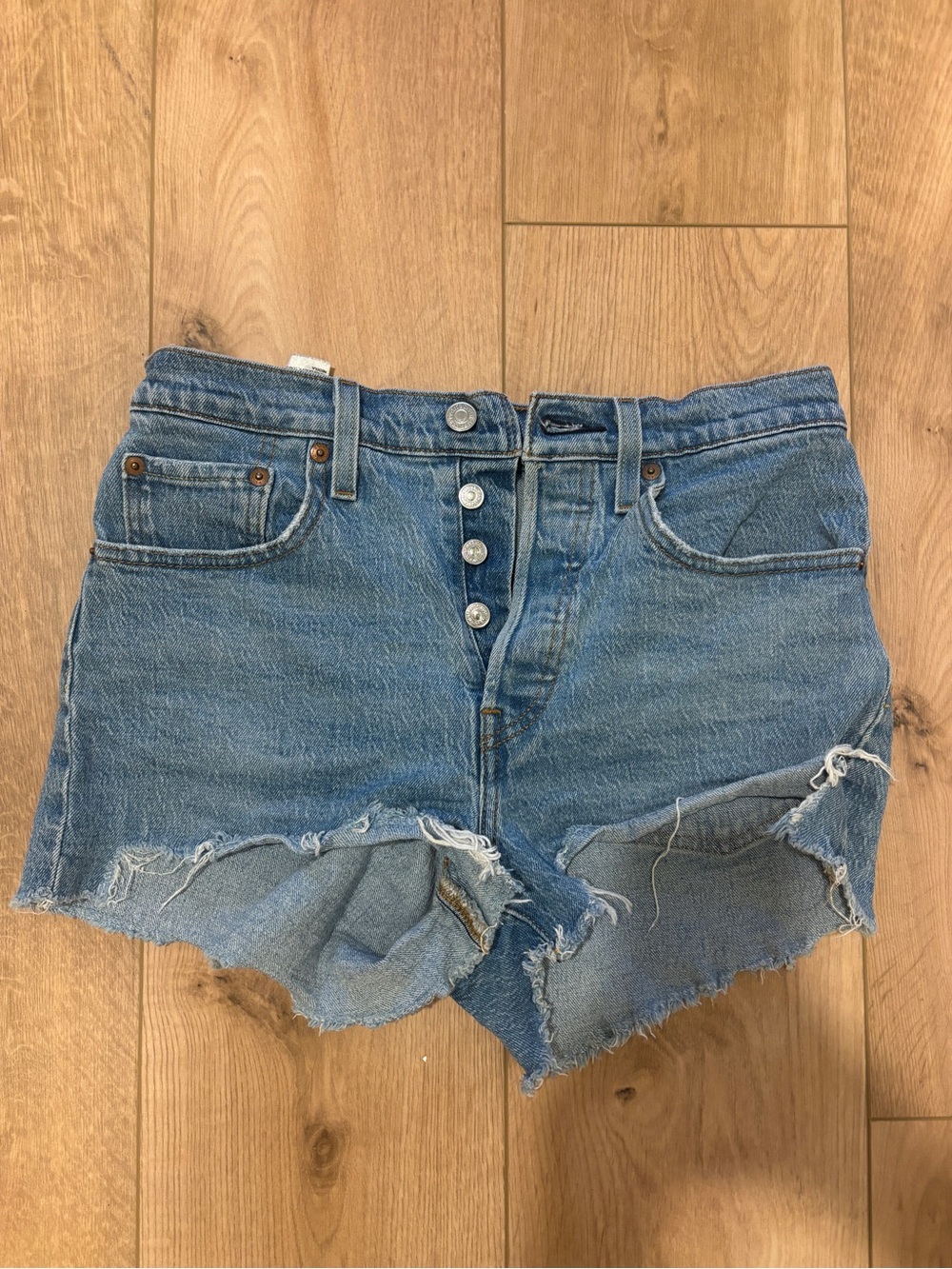 Levi's Medium Blue Distressed Denim Cutoff Shorts